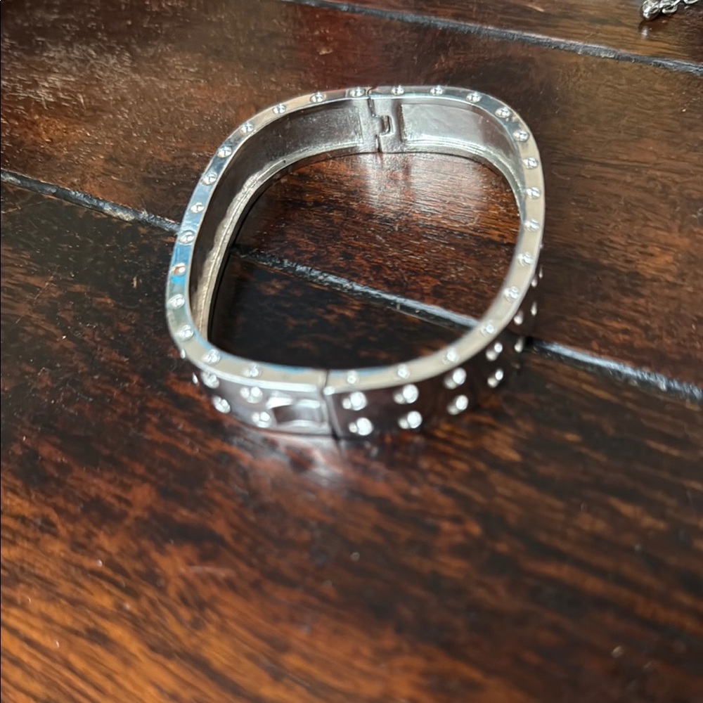 Sleek Silver Hinged Bracelet with Studded Design
